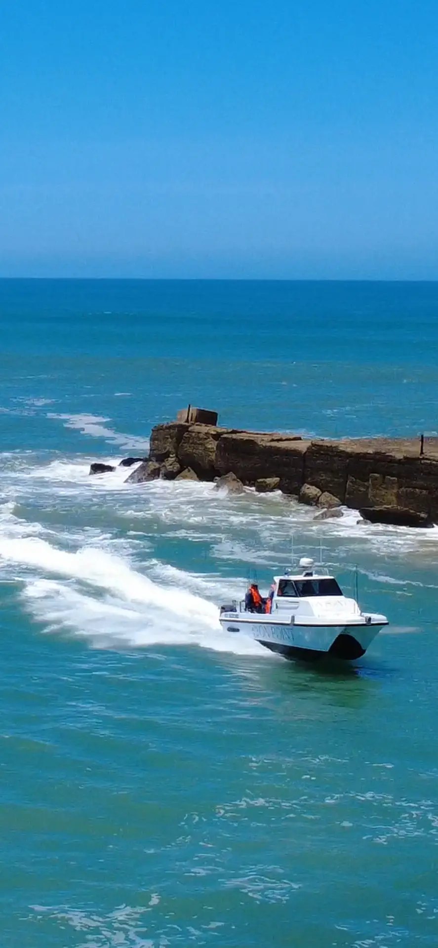 The On Point charter boat running in past the Port Alfred jetty breakwater